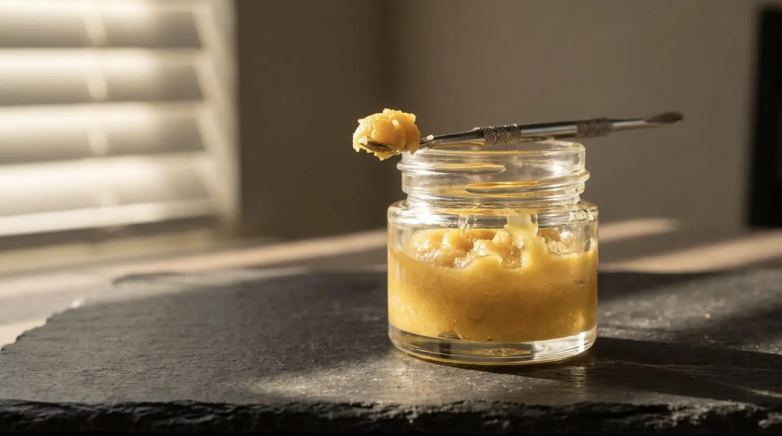 A jar of rosin on slate