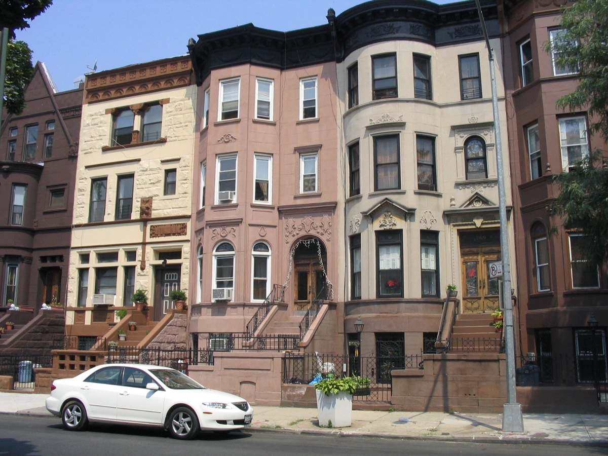 A row of brownstones with stoops in Bedford-Stuyvesant